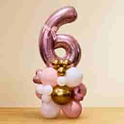rose gold number 6 balloon arrangement